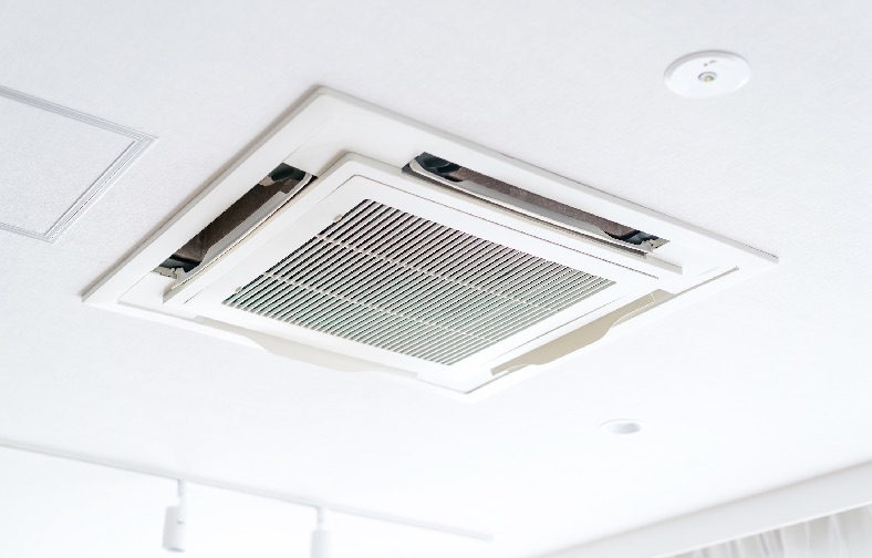 A ceiling cassette mounted air-conditioned in an open plan living area.