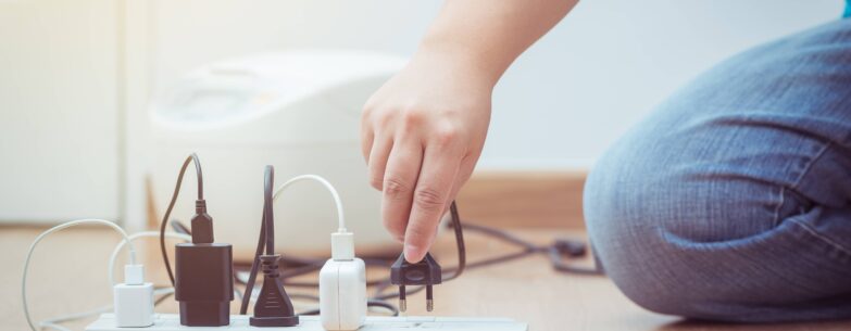 Man unplugging cables.