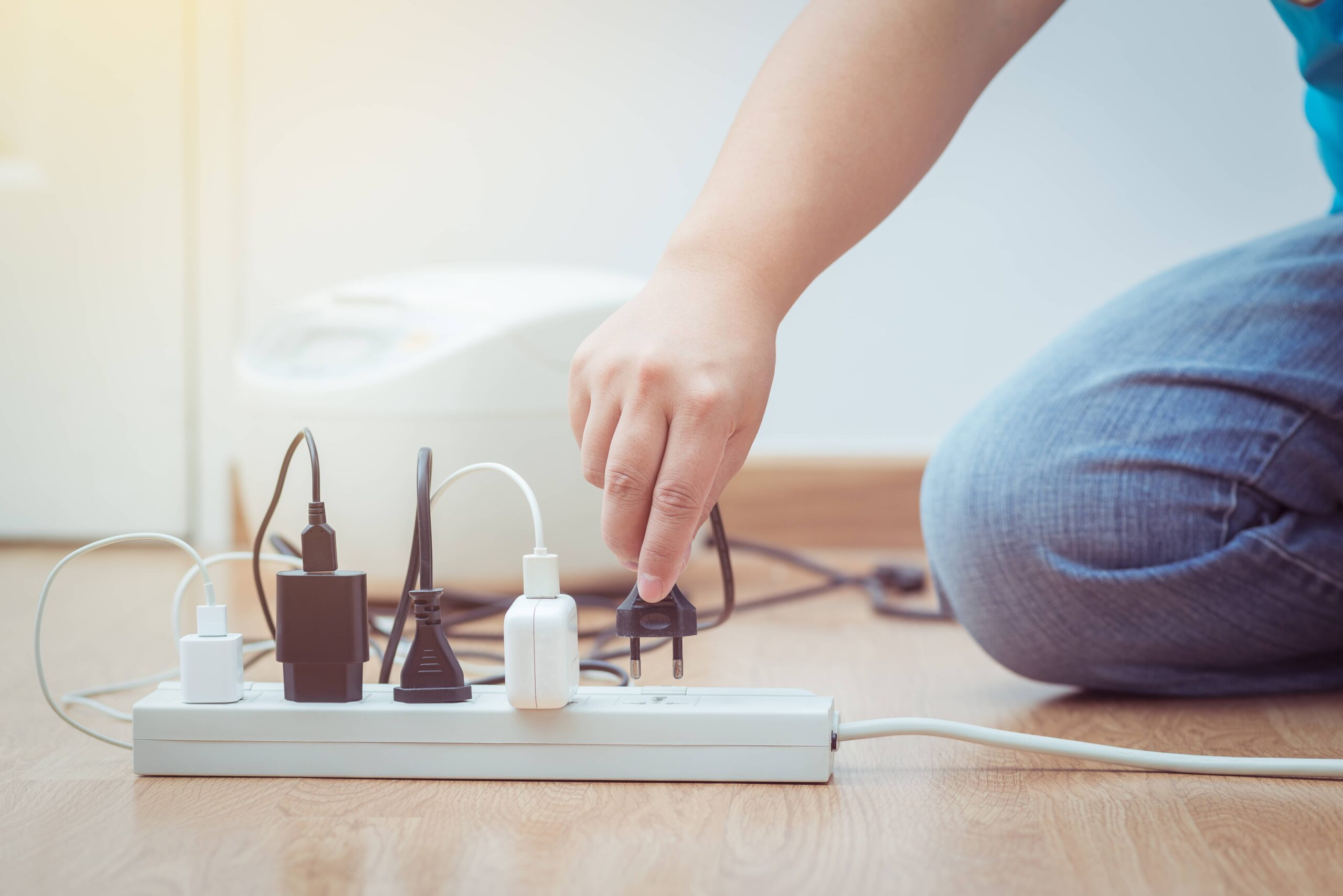 Man unplugging cables.