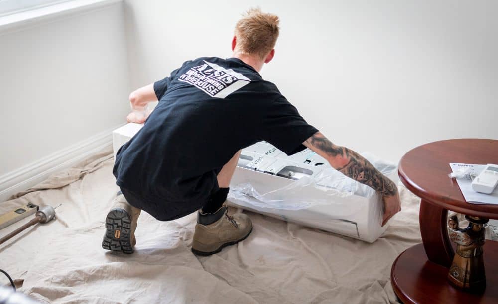ACSIS staff installing split-type air conditioner. ACSIS staff installing split-type air conditioner.